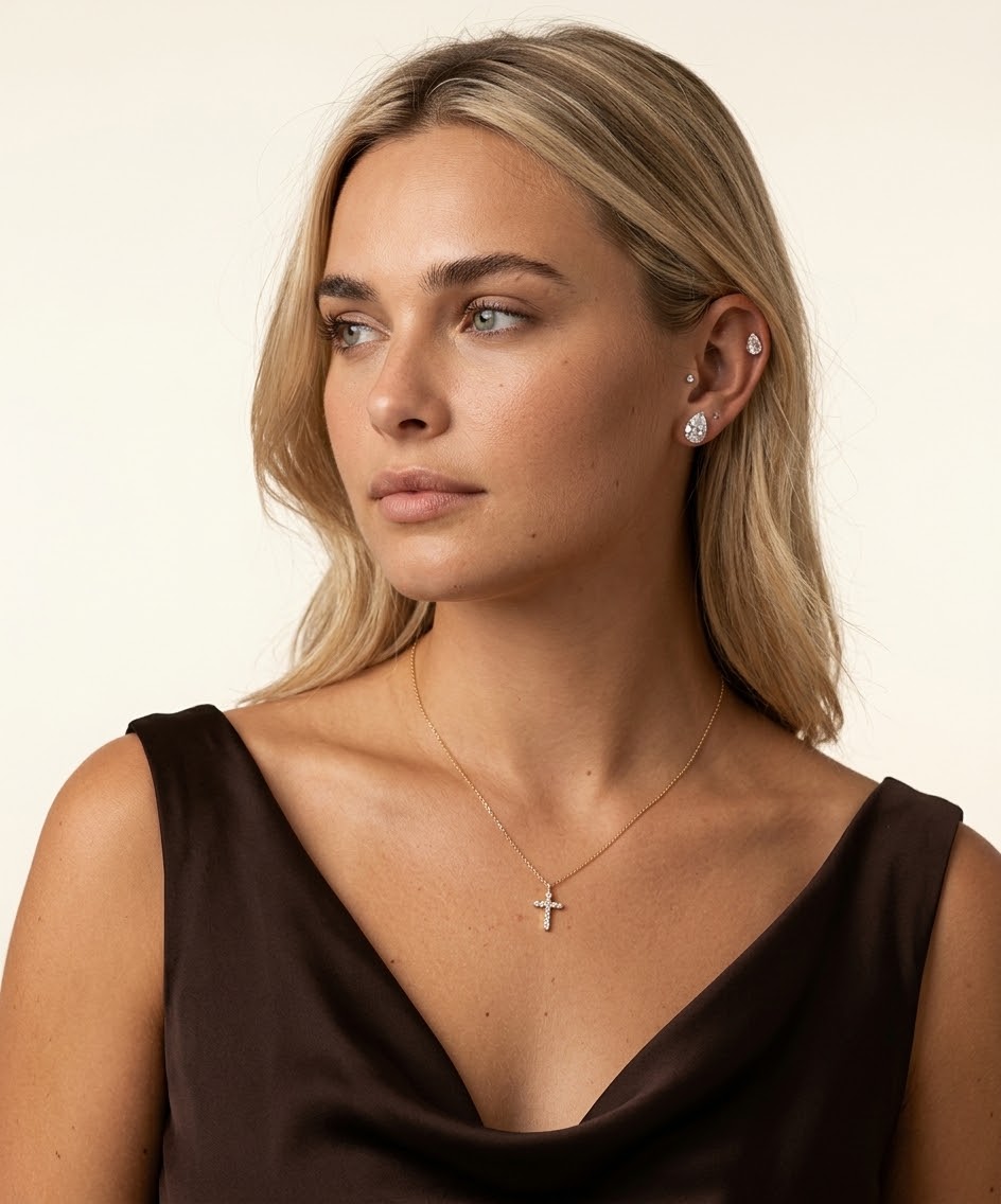 RUVÉL 14K gold cross necklace on model
